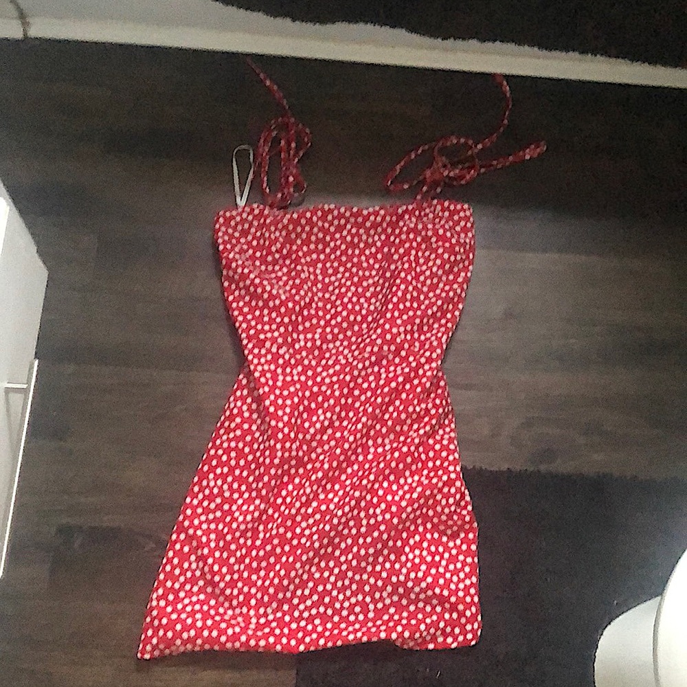 It a red flower dress with adjustable straps